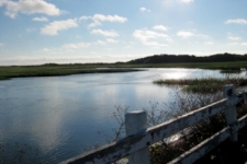 photo taken from the beginning of the Provincetown breakwater barrier jettie, showing the tidal inlet that flows alongside the jettie
